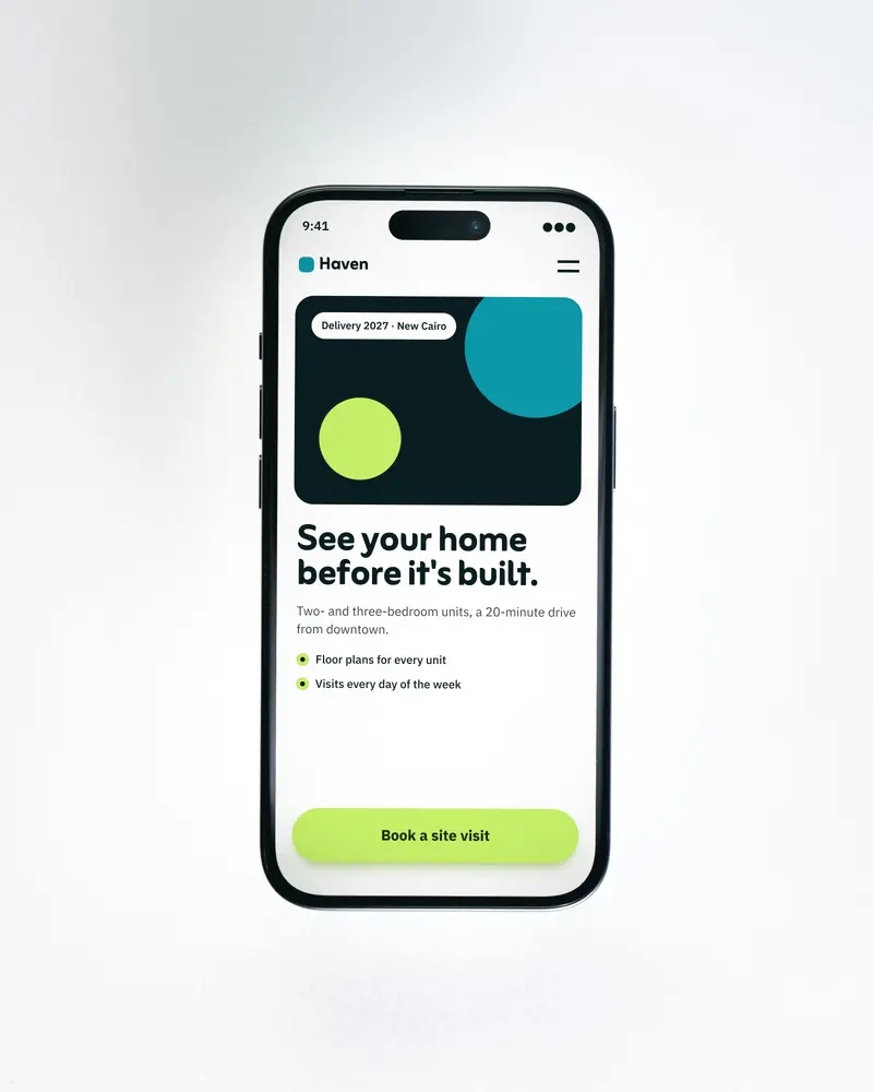 A phone on a white background showing a real estate landing page with one lime 'Book a site visit' button